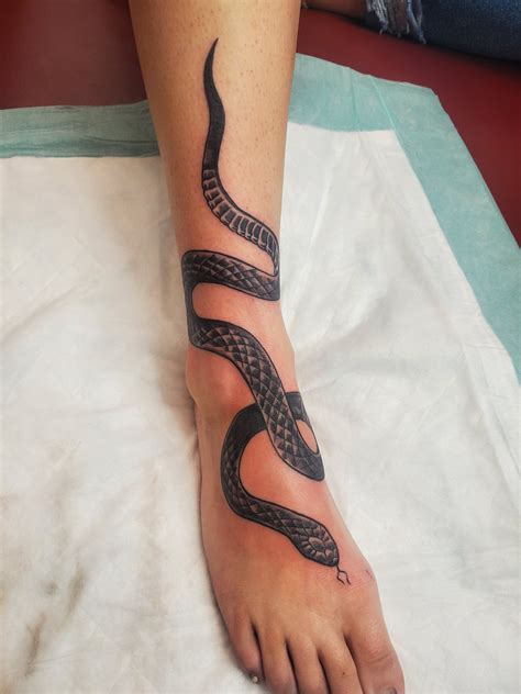 gucci snake tattoo wrapped around arm|snake ankle wrap tattoo.